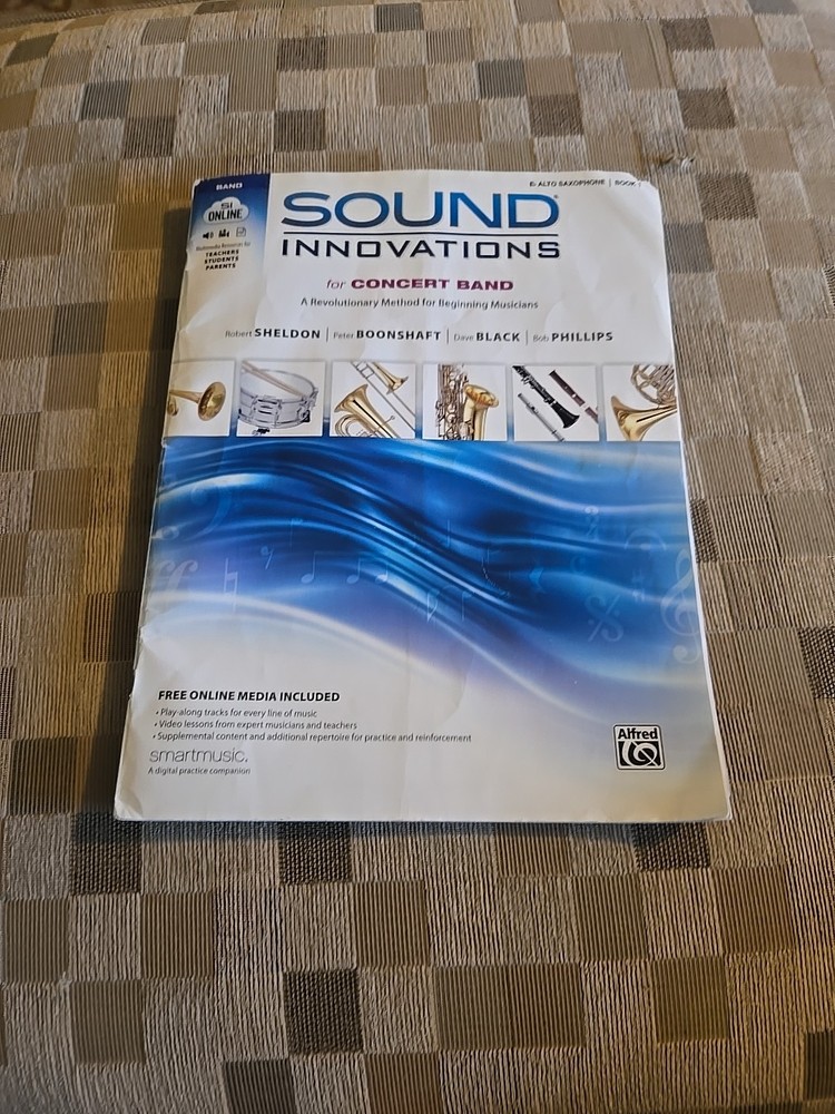 Music book. For a trumpet, a saxophone, clarinet and French orange