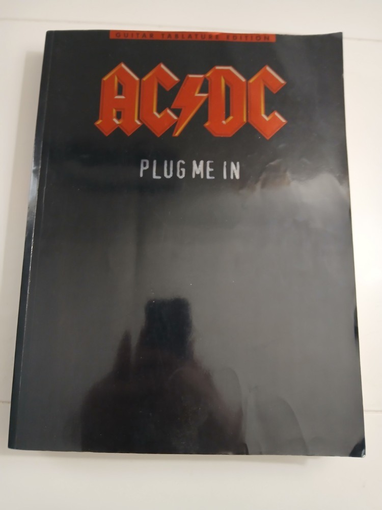 AC/DC Plug Me In Electric Guitar Tabulature Rock Song Book by Amsco Publications